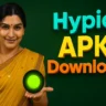 A smiling woman with dark hair styled in a braid adorned with white flowers (likely jasmine) is holding her left hand out, palm up, with a glowing green orb floating above it. She is wearing a yellow saree and a gold necklace. To her right, large, bold 3D text in shades of blue, yellow, and orange reads "Hypic APK Download." The background is a dark green.